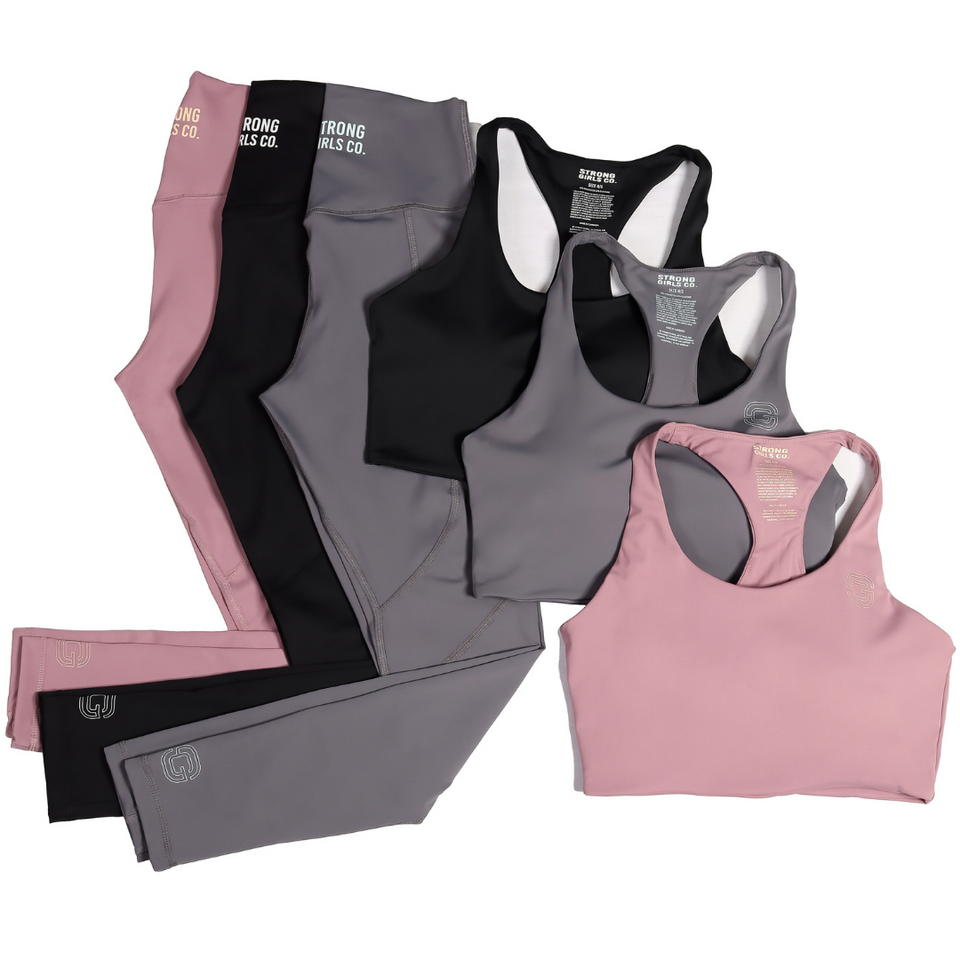 Three pairs of legging, pink, grey and black and three crop tops, pink grey and black.