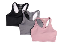 Load image into Gallery viewer, Three crop tops, pink, grey and black laid flat overlapping each other with a small logo on the top left side of each item and care instructions on the inside of the item with the words Strong Girls Co.
