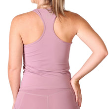 Load image into Gallery viewer, Back of a woman wearing pink activewear leggings and a pink racer back style top with a small white logo in the upper middle back.
